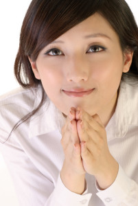 Portrait of hope and pray expression on business woman of Asian.